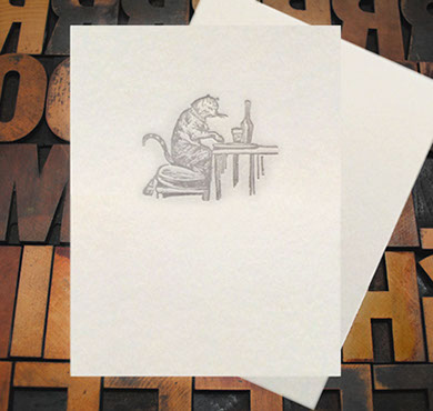 Letterpress Card with an image of a cat drinking wine and eating cheese at a table